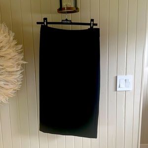Beautiful Burberry over knee skirt with stylish bow in the front. New!